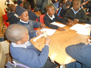 Learners at St Mary's working in groups to make a rocket